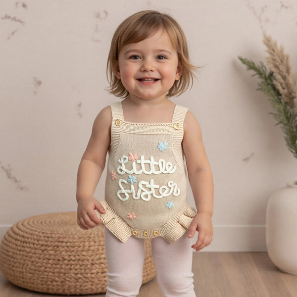 Cream_baby_romper_with_ruffle_straps_600x600.jpg